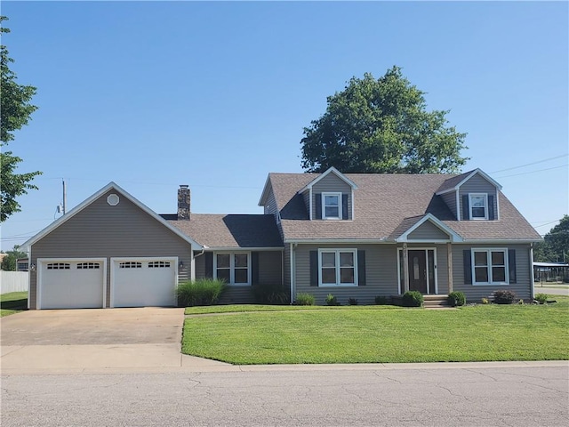 cape cod house with a garage and a front yard