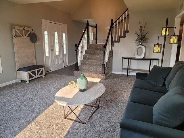 501 Meadow Ln, Fort Scott, KS 66701 - living room featuring dark carpet and vaulted ceiling