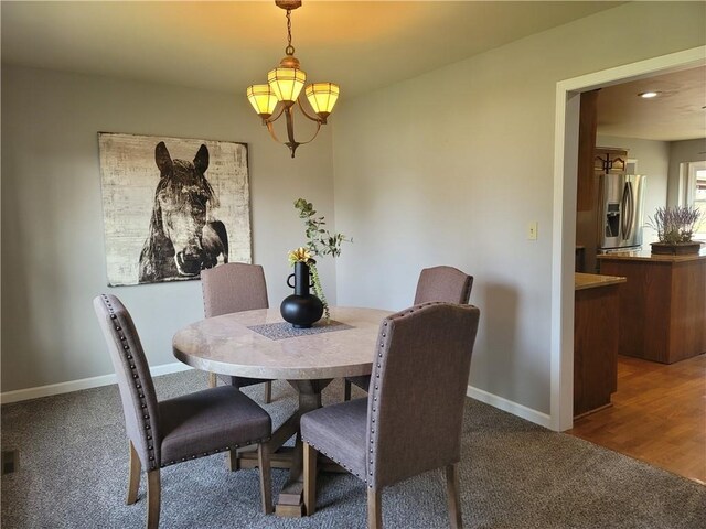 501 Meadow Ln, Fort Scott, KS 66701 - dining area with dark colored carpet