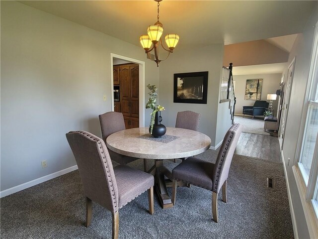 501 Meadow Ln, Fort Scott, KS 66701 - dining space with a notable chandelier and carpet