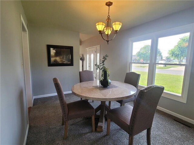 501 Meadow Ln, Fort Scott, KS 66701 - carpeted dining area featuring a notable chandelier