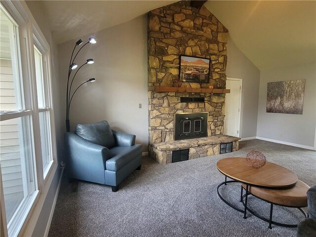 501 Meadow Ln, Fort Scott, KS 66701 - carpeted living room with a stone fireplace and lofted ceiling