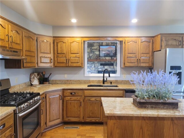 501 Meadow Ln, Fort Scott, KS 66701 - kitchen with sink, stainless steel gas range, and refrigerator with ice dispenser