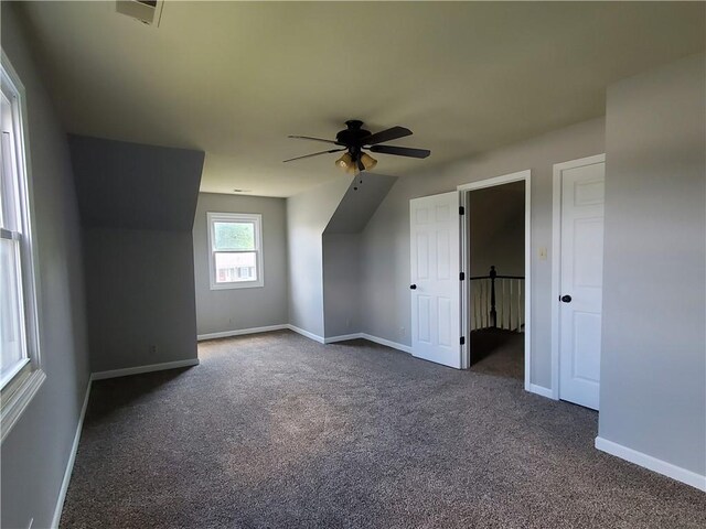 501 Meadow Ln, Fort Scott, KS 66701 - additional living space featuring dark colored carpet and ceiling fan