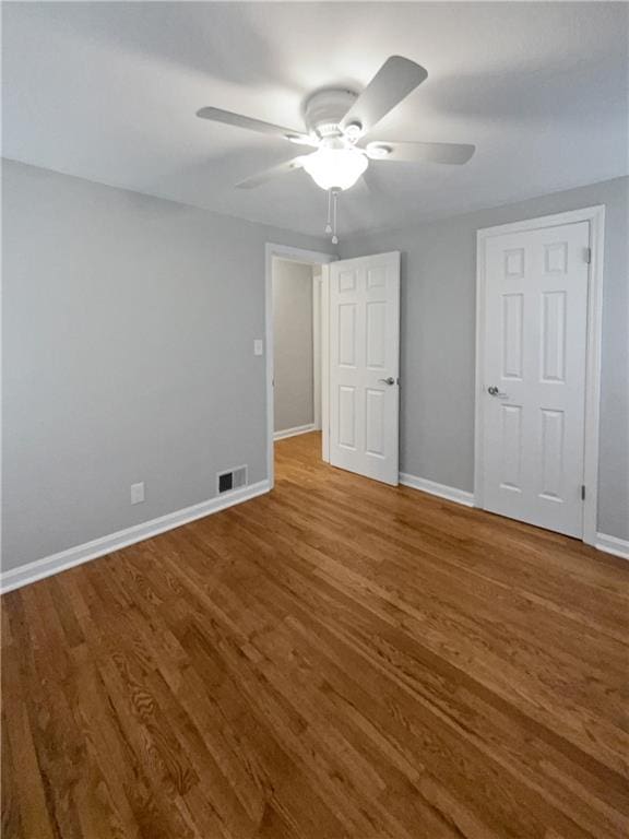 unfurnished bedroom with wood-type flooring and ceiling fan