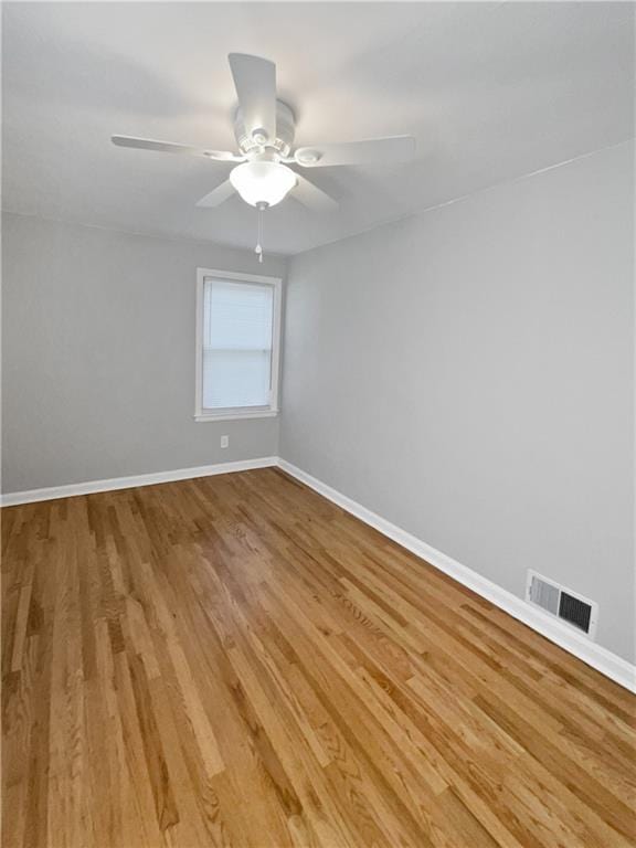 unfurnished room featuring light hardwood / wood-style flooring and ceiling fan