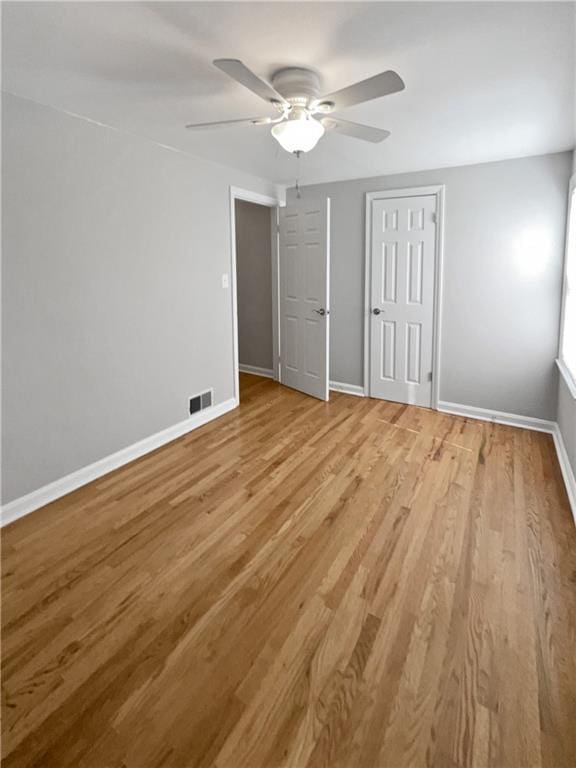 unfurnished bedroom with light hardwood / wood-style flooring and ceiling fan