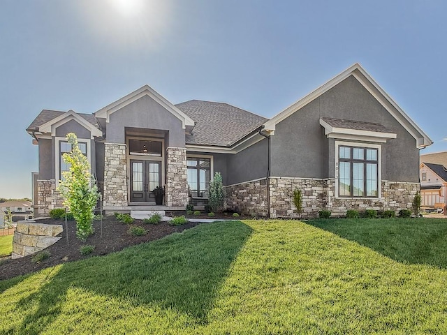 view of front of property featuring a front lawn and french doors