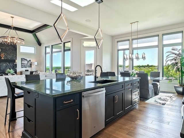 8013 Millridge St, Shawnee, KS 66220 - kitchen with an inviting chandelier, stainless steel dishwasher, open floor plan, and a sink