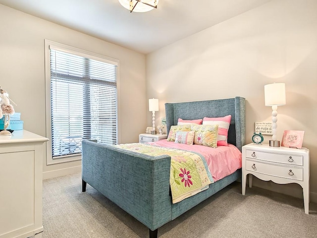 8013 Millridge St, Shawnee, KS 66220 - bedroom featuring baseboards, multiple windows, and light colored carpet