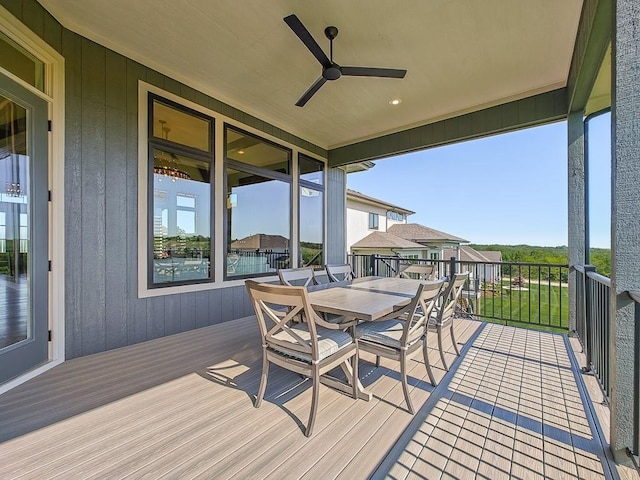 8013 Millridge St, Shawnee, KS 66220 - deck with outdoor dining area and a ceiling fan