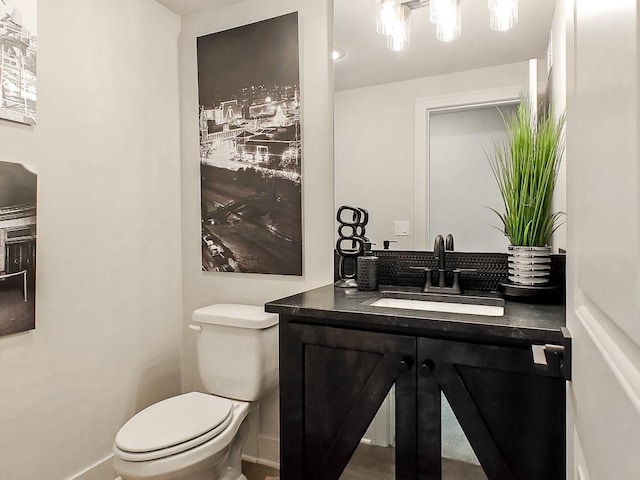 8013 Millridge St, Shawnee, KS 66220 - bathroom with toilet, baseboards, and vanity