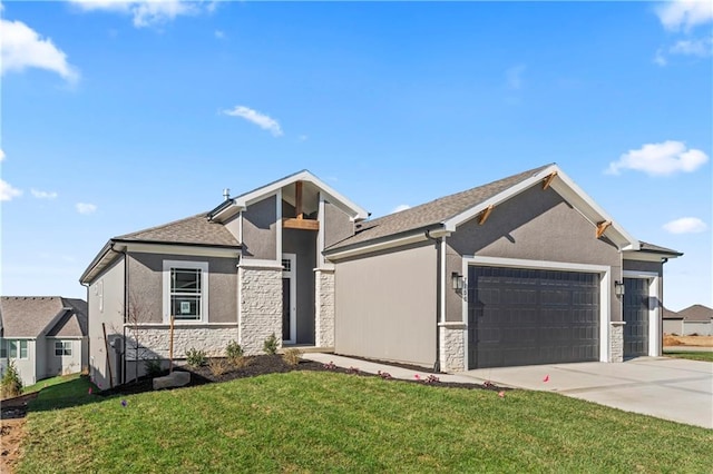 view of front facade with a garage and a front yard