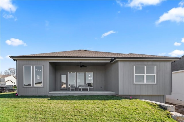 back of house with a patio area, a lawn, and ceiling fan