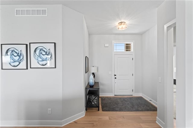 entryway with light hardwood / wood-style floors