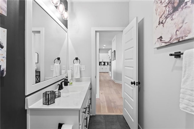 bathroom featuring vanity and hardwood / wood-style floors