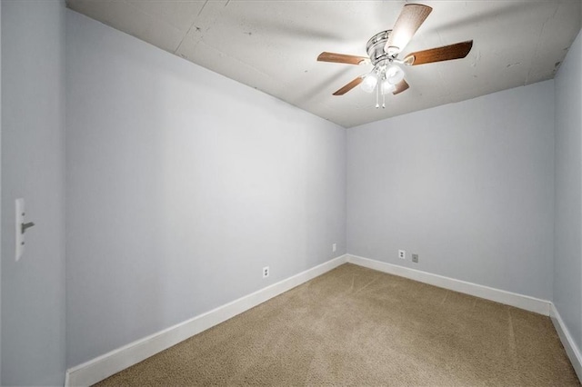 empty room with ceiling fan and carpet