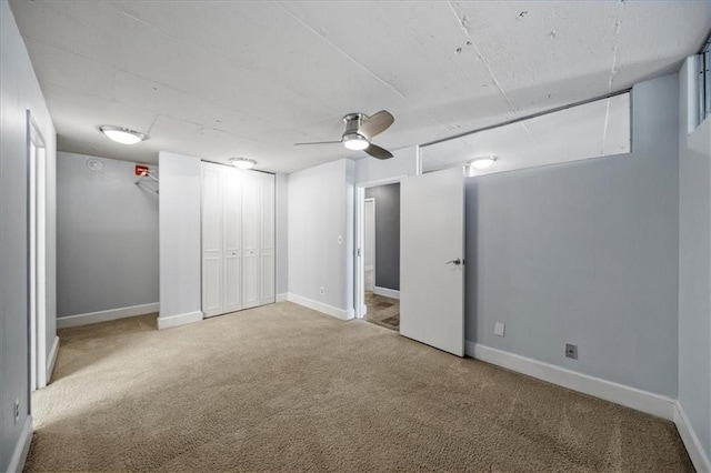 unfurnished bedroom with light carpet and ceiling fan