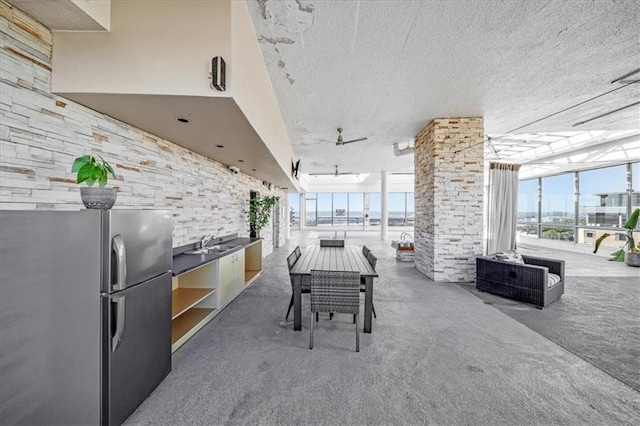 view of patio featuring sink and an outdoor kitchen