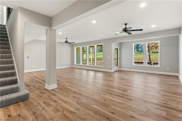 unfurnished living room with light hardwood / wood-style floors and ceiling fan