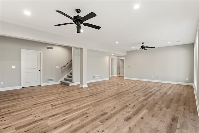 unfurnished living room with ceiling fan and light hardwood / wood-style floors