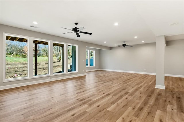 unfurnished living room featuring light hardwood / wood-style floors and ceiling fan