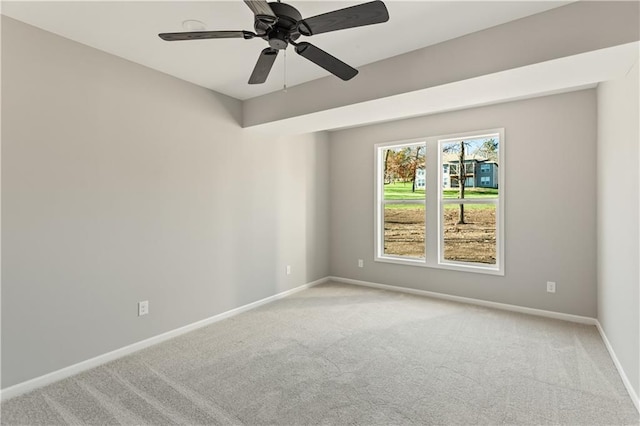 unfurnished room featuring light carpet and ceiling fan