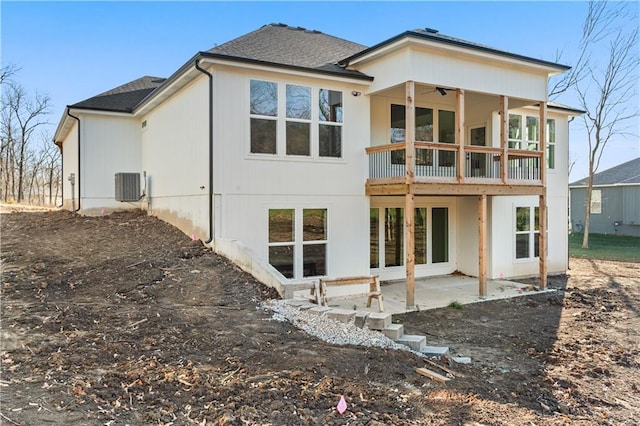 back of house with central air condition unit, a patio area, and ceiling fan