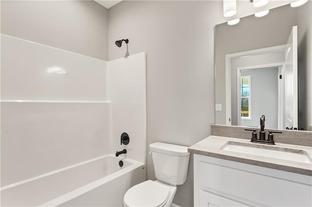 full bathroom with vanity, bathtub / shower combination, and toilet