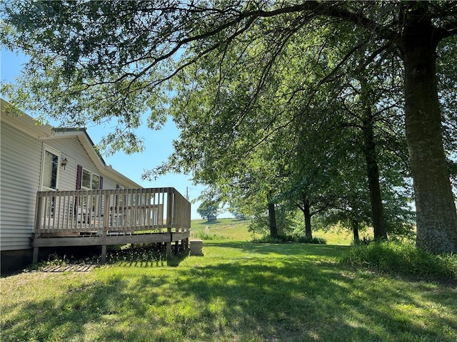 view of yard with a wooden deck