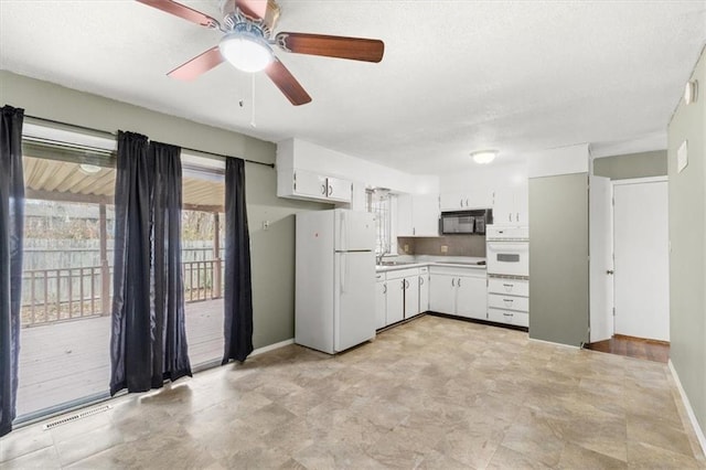 kitchen featuring ceiling fan, white cabinetry, white appliances, and sink