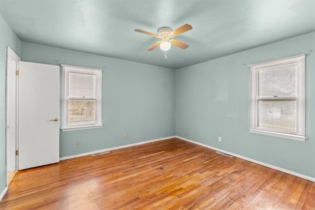 spare room featuring ceiling fan and light wood-type flooring