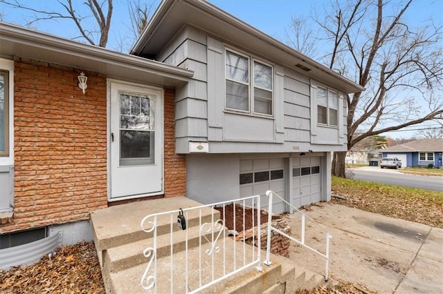 view of exterior entry featuring a garage