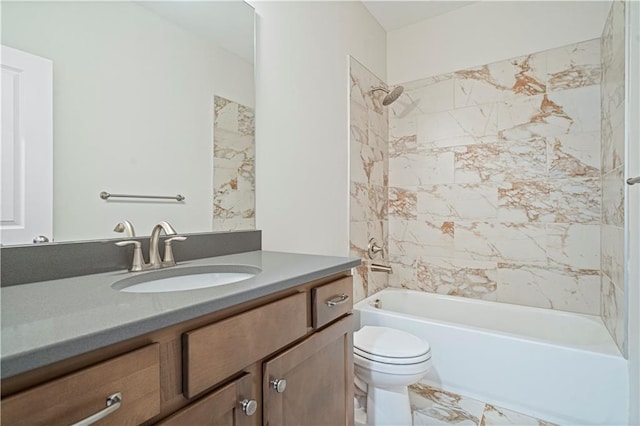 full bathroom with toilet, vanity, and tiled shower / bath