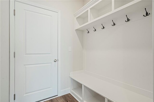 27017 E Olive Dr, Lees Summit, MO 64086 - mudroom with dark wood-style floors and baseboards