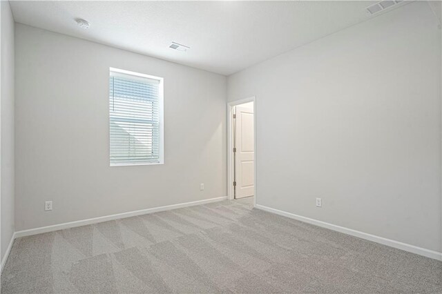 27017 E Olive Dr, Lees Summit, MO 64086 - spare room with baseboards and light colored carpet