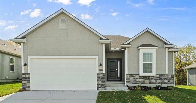 27017 E Olive Dr, Lees Summit, MO 64086 - view of front of house with driveway, stone siding, stucco siding, a front lawn, and an attached garage