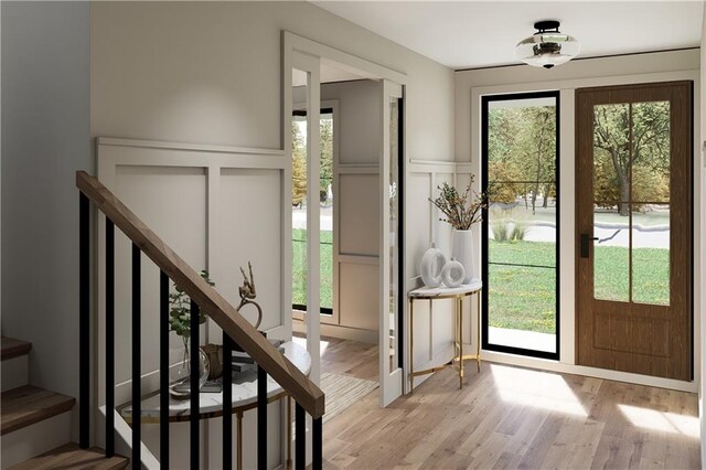 entryway with light hardwood / wood-style flooring