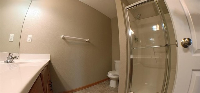 bathroom with tile flooring, a shower with door, lofted ceiling, toilet, and large vanity