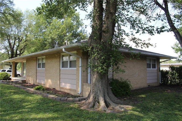 view of property exterior with a yard