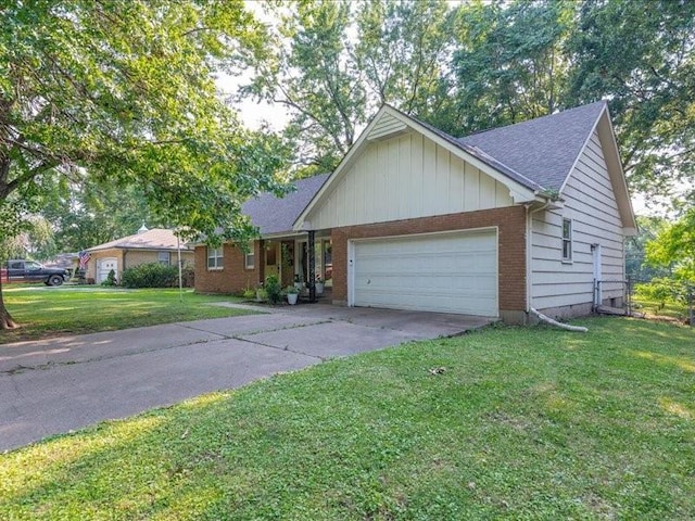 view of front of property with a front yard and a garage