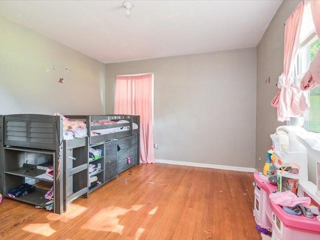 bedroom with wood-type flooring