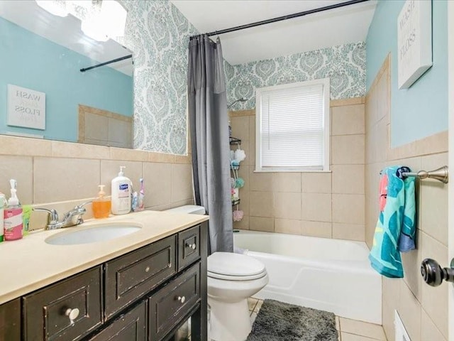 full bathroom featuring tile walls, vanity, shower / tub combo, toilet, and tile patterned floors