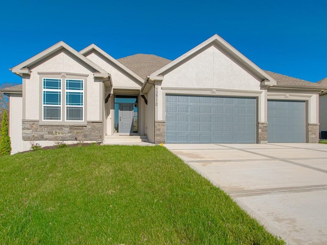 16430 NW 123rd St, Platte City, MO 64079 - view of front of house featuring an attached garage, a front lawn, stone siding, and driveway