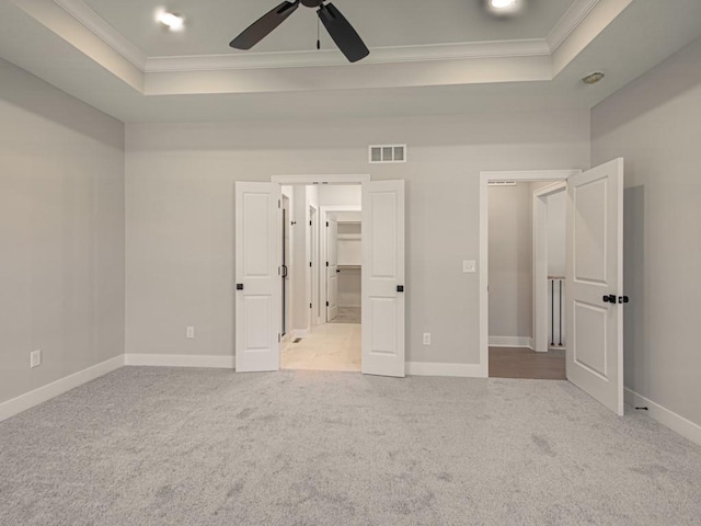 16430 NW 123rd St, Platte City, MO 64079 - unfurnished bedroom featuring carpet flooring, baseboards, a raised ceiling, and ornamental molding