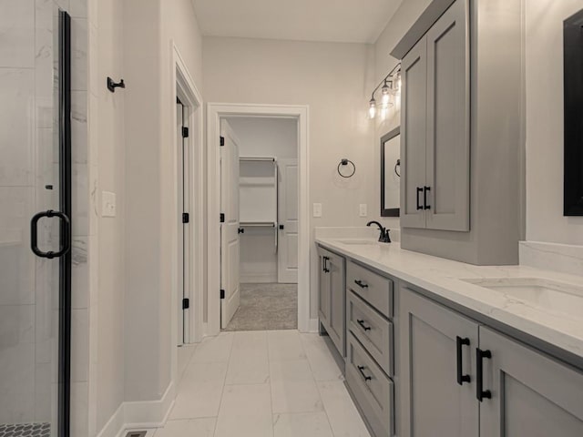 bathroom featuring vanity and an enclosed shower