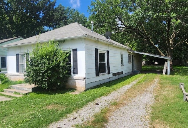 view of home's exterior featuring a lawn