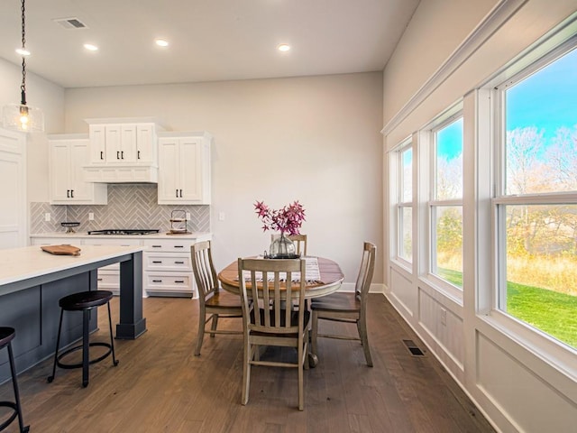 12435 Appaloosa St, Platte City, MO 64079 - dining room featuring healthy amount of natural light, dark wood-type flooring, recessed lighting, and baseboards