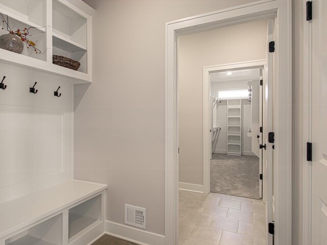 12435 Appaloosa St, Platte City, MO 64079 - mudroom with baseboards and light colored carpet