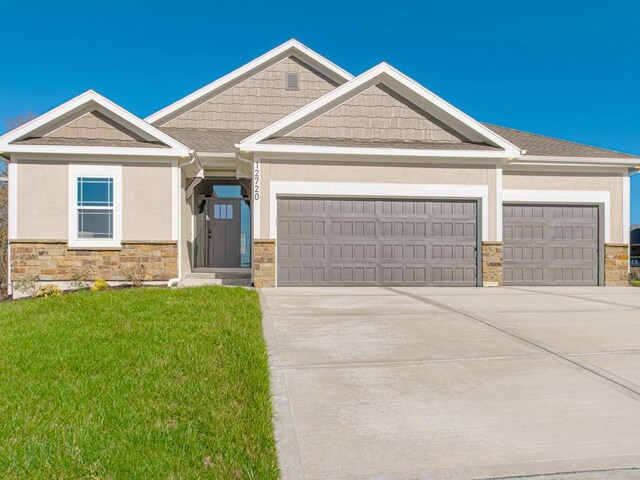 12435 Appaloosa St, Platte City, MO 64079 - craftsman-style house featuring stone siding, a garage, driveway, and a front yard